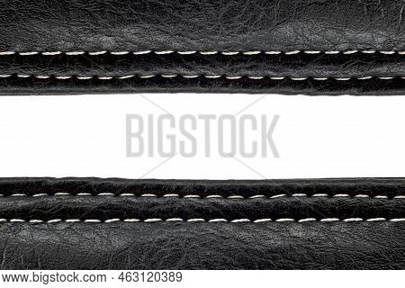 A Piece Of Leather Stitched With Threads On A White Background With Free Space For An Inscription. L