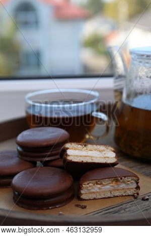 Tasty Choco Pies And Tea On Wooden Tray