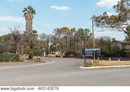 Loxton, South Africa - Sep 2, 2022: A Street Scene, With An Historic Directional Sign In Miles, In L