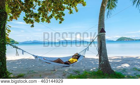 Hammock On The Beach Between Palm Trees Of Koh Mak Tropical Island Thailand