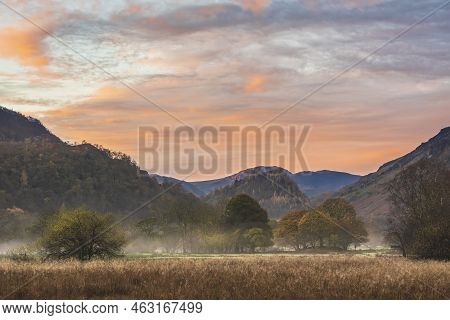 Stunning Autumn Landscape Sunrise Image Looking Towards Borrowdale Valley From Derwentwater In Lake 