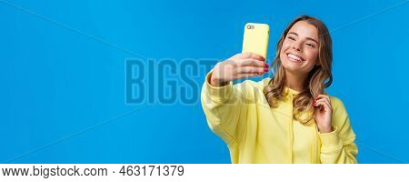Close-up Portrait Tender Cute Blond Girl In Yellow Hoodie, Holding Mobile Phone, Taking Selfie With 