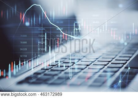 Close Up Of Laptop With Glowing Candlestick Forex Chart And Map Hologram On Blurry Background. Stock