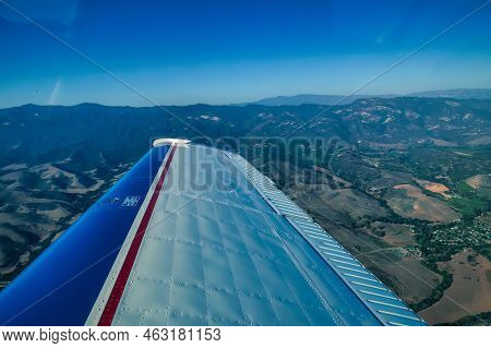 Hanford, United States - October 13 2013 : A Wing Of A Small Private Plane Flying Over California Fr