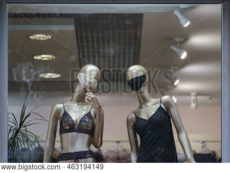 Two Female Mannequins Wear In Mask Looking On You, Underwear Dressed.