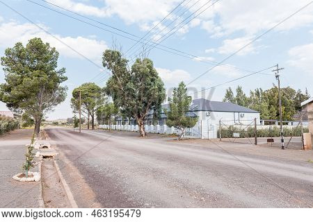 Loxton, South Africa - Sep 2, 2022: A Gravel Street Scene, With The Karos Guesthouse, In Loxton In T