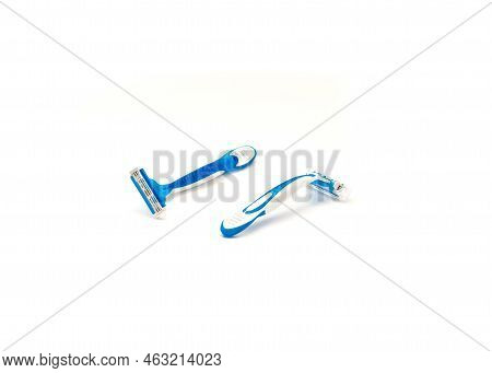 One Sharp Plastic Disposable Razor With Ergonomic Handle Has Plastic Cover And One Without Isolated 