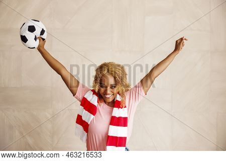 Female Football Fan Holding A Soccer Ball Cheering For Her National Team At The World Championship
