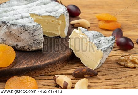 Brazilian Artisan Lua Cheia Cheese With Fruits And Nuts Over Wooden Table.