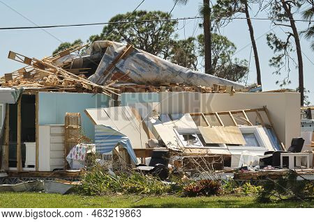 Severely Damaged By Hurricane Ian House In Florida Mobile Home Residential Area. Consequences Of Nat