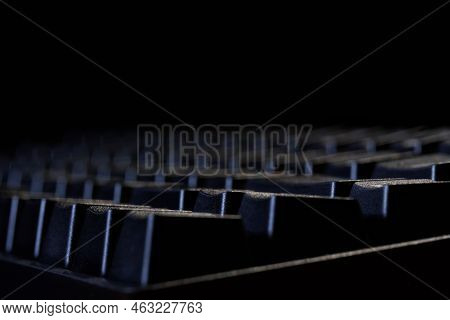 Black Mechanical Gaming Computer Keyboard On A Black Background. Side View. Copy Space. Macro. Selec