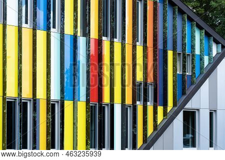 Dilbeek, Flemish Brabant Region, Belgium - 7 2 2021 Abstract Colors And Lines From The Facade Of A C