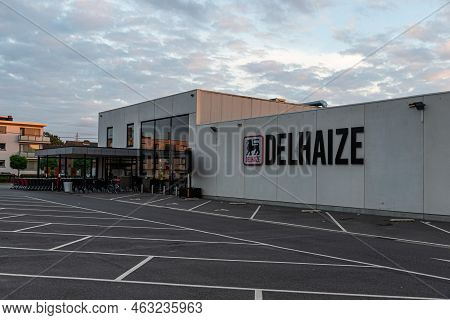 Merchtem, Flemish Brabant - Belgium - 09 12 2021 Delhaize Retail Super Market And Parking Lot
