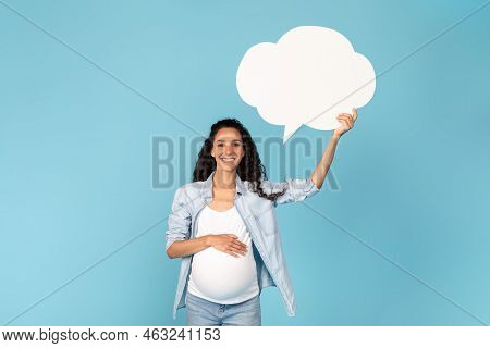 Happy Millennial Pregnant Arab Woman With Belly Holding Abstract Cloud Buble With Copy Space