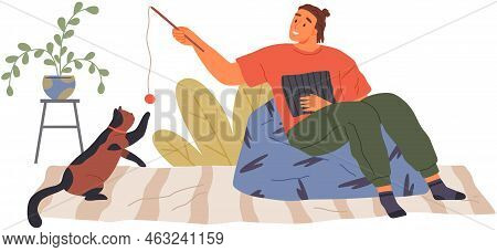 Male Pet Owner With Cat Training, Playing With Ball. Caring For Four-footed Friend Concept. Happy Gu