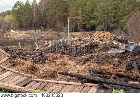 Ruins Of House Burnt In Flame Due To Fire In The Forest During Very Dry Weather. Ashes Against The B