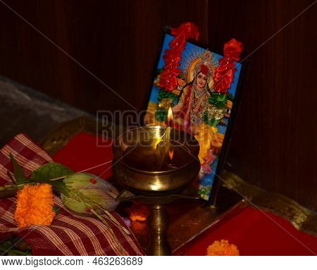Delhi - India
9th Oct 2022
A Diya Or Lamp Is Illuminated In Front Of Goddess Laxmi.  Laxmi Puja Fest