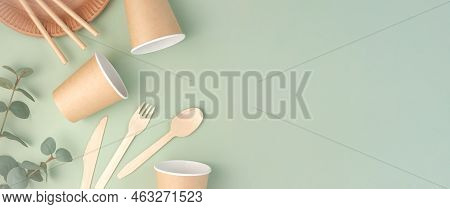 Eco - Friendly Tableware On Green Background. Top View. Plastic Free Set Of Brown Paper Utensil. Str