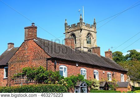 Burton-on-trent, Uk - August 7, 2020 - Row Of Traditional Red Brick Building With All Saints Church 