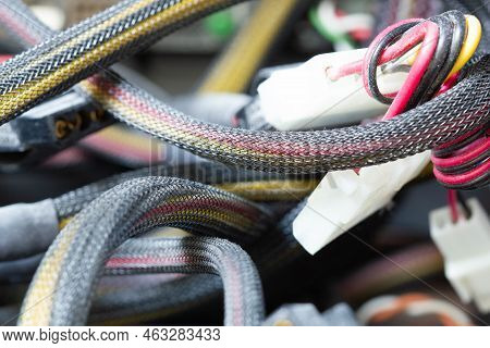 Very Dirty Wires, Connectors And Plugs In The Computer. Old Multi-colored Wires In A Braided Wrapper