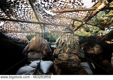 Close-up Soldiers Firing A 50 Cal Machine Gun With Spent Brass Around It