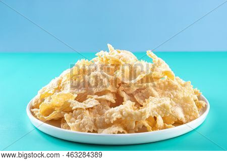 Sfrappole Or Chiachiere Or Angel Wings On A Bright Blue Background. Italian Carnival And Typical Foo