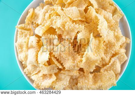 Sfrappole Or Chiachiere Or Angel Wings On A Bright Blue Background. Italian Carnival And Typical Foo