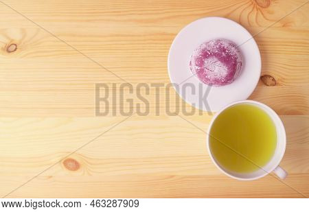 Japanese Purple Sweet Potato Daifuku Or Red Bean Paste Filling Rice Cake With Green Tea On Wooden Ta
