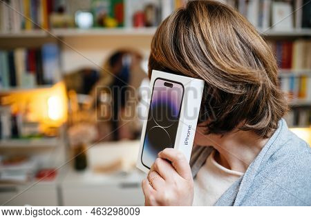 London, United Kingdom - Sept 28, 2022: Woman Holding White Cardboard Package Near Ear - Cardboard P