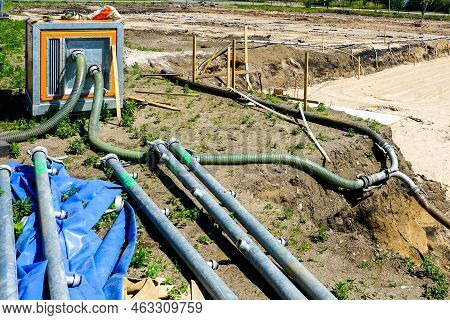 Large Portable Electric Water Pump With Hose For Dewatering The Deep Pit Of The Building Foundation,
