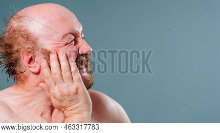 Side View Of An Elderly Man Holding His Cheek, Toothache, Mustache, Beard, Wrinkled Face, Grimacing 
