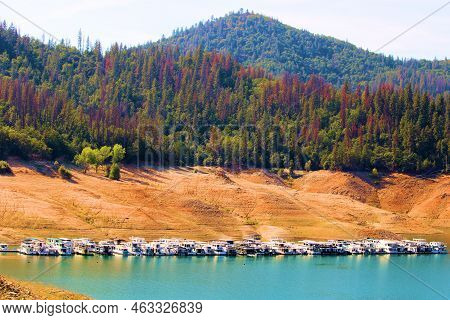 Houseboats Docked At The Shasta Lake, Ca Marina With Low Water Levels At The Lake Caused By A Prolon