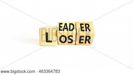 Loser Or Leader Symbol. Concept Words Loser Or Leader On Wooden Cubes. Beautiful White Table White B
