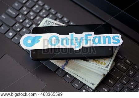 Ternopil, Ukraine - September 6, 2022 Onlyfans Paper Logotype On Bunch Of Us Dollar Bills Lies On Bl