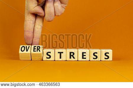 Over Stress Symbol. Psychologist Turns Wooden Cubes And Changes The Concept Word Stress To Over Stre