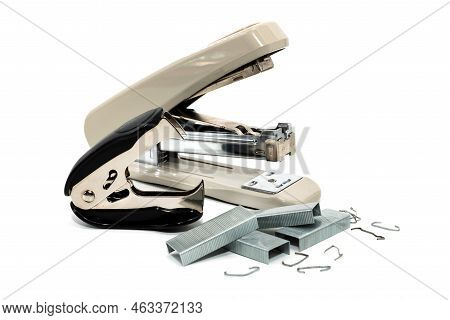 Stapler And Anti-stapler With Staples On A White Background. Office Supplies Isolate
