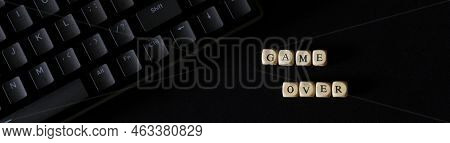 Game Over Inscription On A Black Background Next To A Black Mechanical Keyboard. Fate, Destiny, Gamb