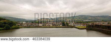 Banner View Of A Small Town Across The River In Cloudy Weather