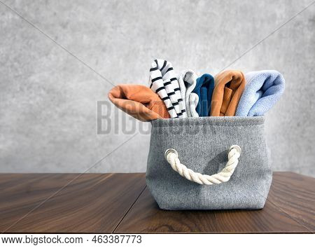 Folded Textile On Wooden Table Empty Space Background.winter,autumn Clothes. Warm Clothing Set.