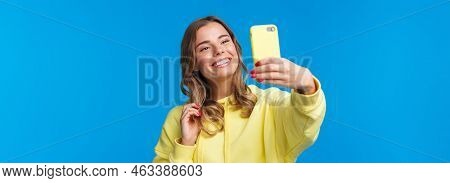 Close-up Portrait Tender Cute Blond Girl In Yellow Hoodie, Holding Mobile Phone, Taking Selfie With 