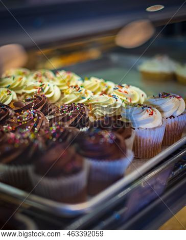Different Capcakes With Chocolate And Vanilla Cream Dessert. Peanut Butter Chocolate Cupcake. Chocol