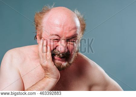 Toothache Does Not Give Rest, An Undressed Elderly Man Holds His Cheek With His Hand, A Tooth Is Inf