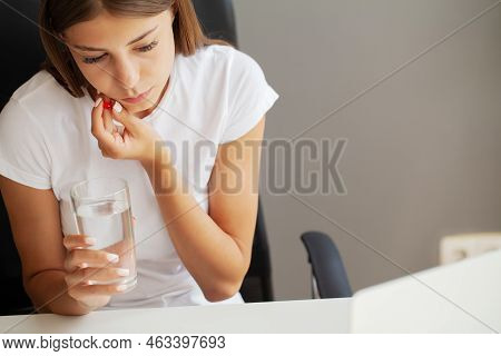 Disillusioned Lady Feeling Pain In Tooth While Working In Office.