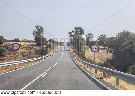 Signs Indicating The Prohibition Of Overtaking. Local Road With Constant Grade Changes