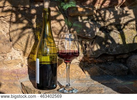 Tasting Of Red Wine By Old Wine Maker In Pierres Dorées Region With Yellow Stone Houses On South Of