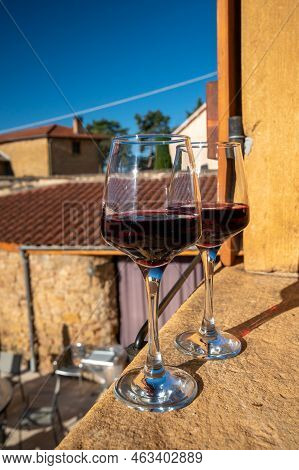 Tasting Of Red Wine By Old Wine Maker In Pierres Dorées Region With Yellow Stone Houses On South Of