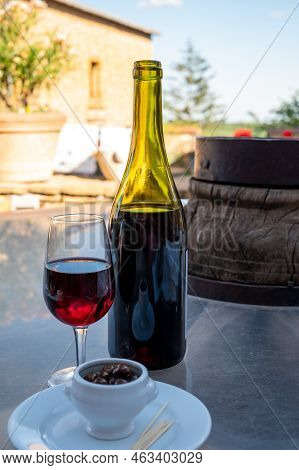 Tasting Of Red Wine By Old Wine Maker In Pierres Dorées Region With Yellow Stone Houses On South Of