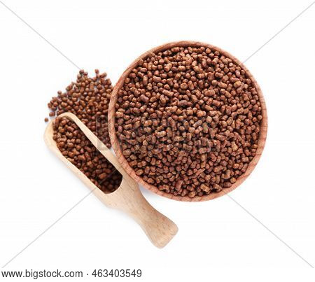 Wooden Bowl And Scoop With Buckwheat Tea Granules On White Background