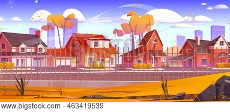 Suburban Street Behind Metal Fence In Autumn. City Suburb District Landscape With Houses, Garages, T