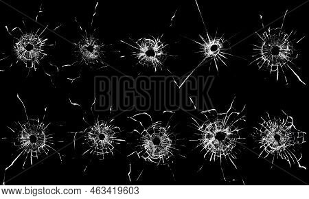 A Group Of Bullet Holes On A Glass Window Abstract Background. Texture For Design Set Of Cracked Bro